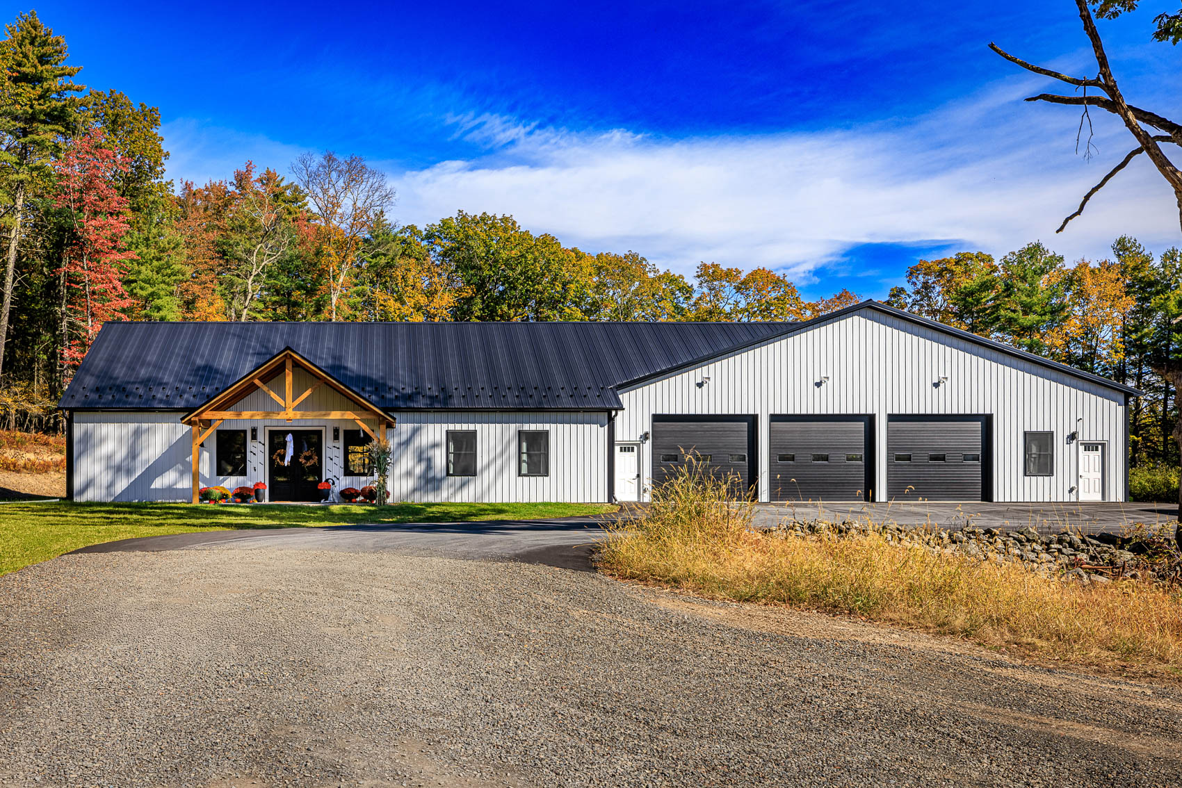 White custom garage and shop building with multiple garage bays